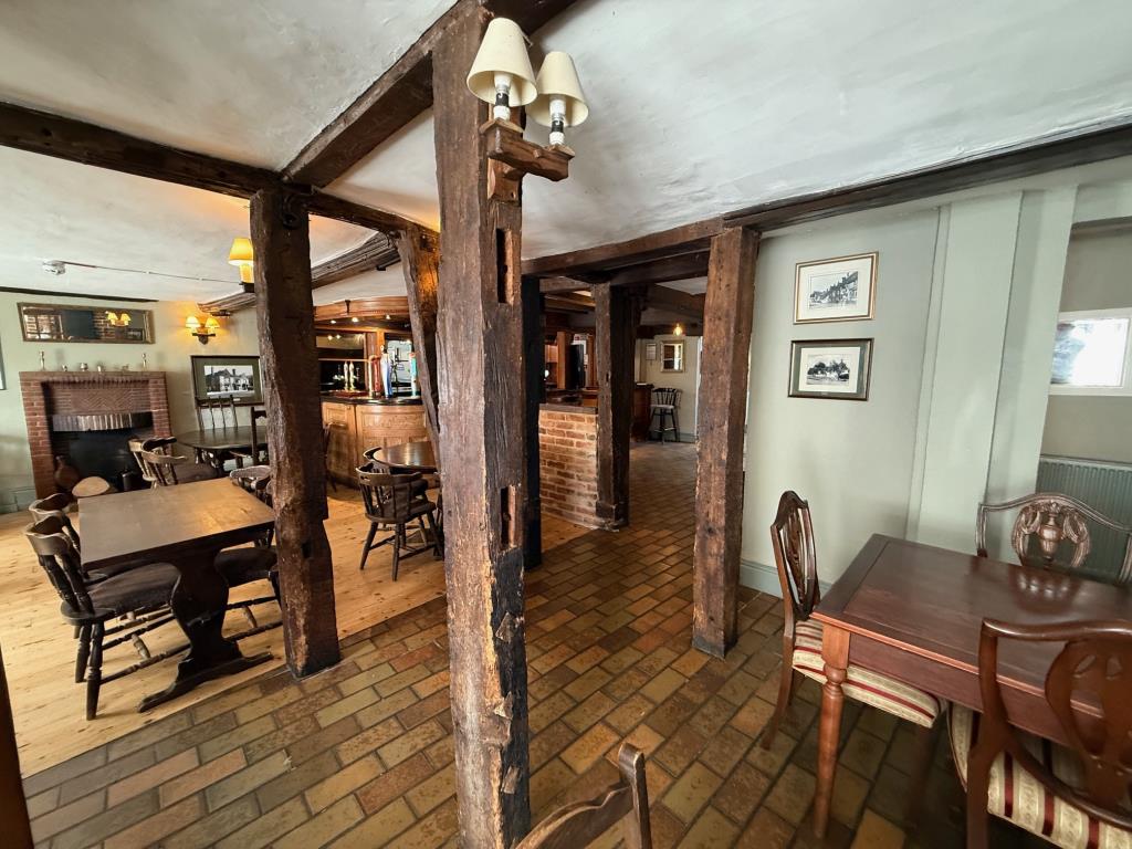 Lot: 129 - FREEHOLD PUBLIC HOUSE SITUATED IN POPULAR SUFFOLK VILLAGE LOCATION - view from the entrace to the pub of the bar and restaurant